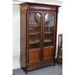 A 19th Century French glass fronted bookcase,