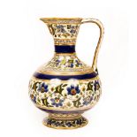A Zsolnay Pecs ewer decorated scrolling foliage and gilt, 28.