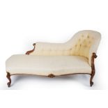 A Victorian walnut framed chaise longue,