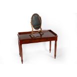 A Victorian mahogany dressing table with three-quarter gallery, fitted two drawers on turned legs,