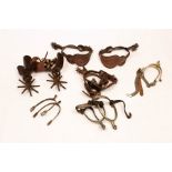 Six pairs of Western spurs, various designs/Note: From the Glenn Tutssel collection,