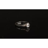 A diamond solitaire ring, the cushion-shaped stone claw set to a platinum shank,
