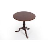 A George III mahogany tripod table with birdcage action,