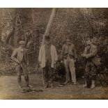 A Victorian silver gelatin print depicting a group of gamekeepers, 24.