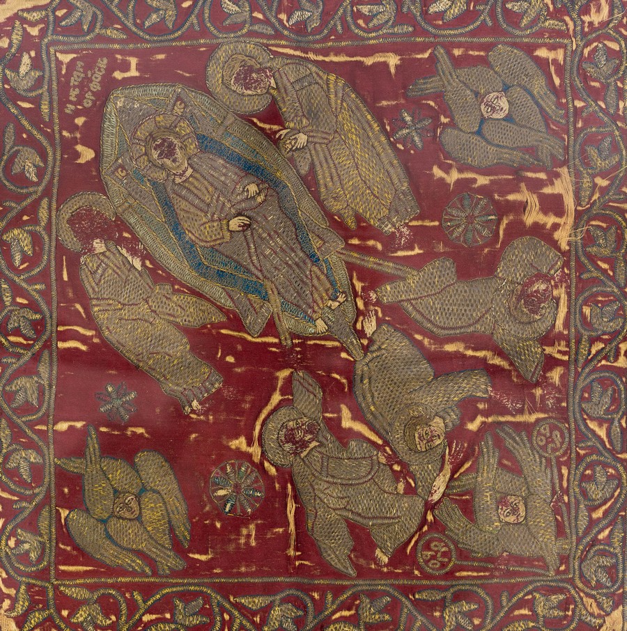 A late 16th Century needlework hassock cover finely embroidered a figure of Christ surrounded by