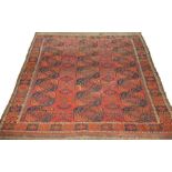 An Afghan carpet circa 1900,