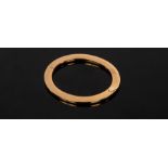 A 9ct yellow gold hinged bangle of flattened form, internal size 53mm x 63mm, approximately 19.