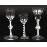 Two 18th Century wine glasses with single series opaque twist knopped stems and a smaller glass