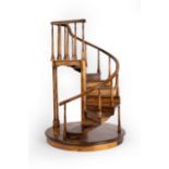 A spiral staircase model, with ten steps and baluster supports to the rail,