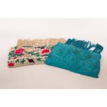 A Spanish finely embroidered shawl decorated all over flowers and another blue ground shawl