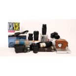 A quantity of camera equipment to include an ACRO triple lens cine camera, Canon EO5 base,