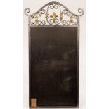 A wrought iron mirror frame (mirror missing),