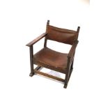 A 19th Century low armchair with leather back and seat