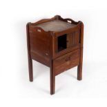 A late 18th Century mahogany tray-top bedside cupboard with tambour cupboard and pull out commode