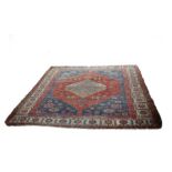 A bordered and figured Bakshaish carpet with central pole medallion, 456cm x 346cm (worn),