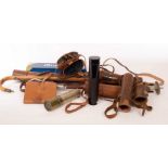 Two telescopes in leather cases, a pair of field glasses,