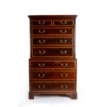 A George III mahogany chest on chest, fitted with two short above six long crossbanded drawers,