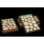 A collection of Grand Tour plaster intaglios in a three-tier box, approximately 83,