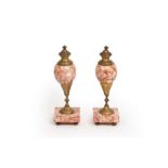 A pair of gilt metal and orange veined marble vases on square bases with brass feet, 23.