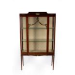 An Edwardian mahogany cushion top display cabinet,