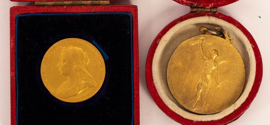 A gold Jubilee medallion, 1837-1897 in original box and a gilt metal medal,