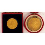 A gold Jubilee medallion, 1837-1897 in original box and a gilt metal medal,