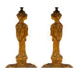 A pair of 19th Century ormolu table lights with Classical triple mask head columns with wreath and