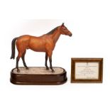 A Royal Worcester figure of Red Rum, modelled by Doris Lindner, number 58/250, on a wooden plinth,