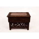 A Tibetan carved prayer table with hinged top, label for Ganemede, Srinagar, Kashmir, No 2156, 61.