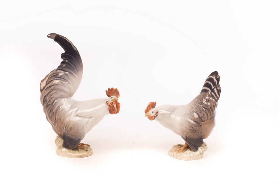 A Royal Copenhagen cock and hen, numbered 1025 and 1024,