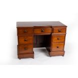 A Victorian mahogany desk fitted an arrangement of drawers around a kneehole, 111cm wide x 52.