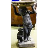 A bird bath with lead putto and dog base,