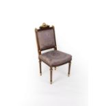 An Empire style chair with wreaths and ribbon tie surmount and spiral moulding to the surround,