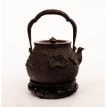 A Japanese cast iron Tetsubin kettle, 19th Century, with bronze cover,