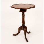 A burr walnut tripod table, the bird cage action top with scalloped edge,