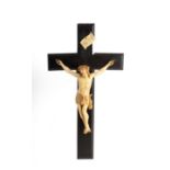 A resin crucifix, the carved figure of Christ to an ebony cross, 40.