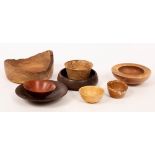 Chris Robertson, four turned wood bowls, various sizes and woods, the largest with natural form rim,