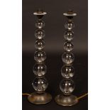 A pair of table lights, the column of each six graduating glass balls,