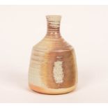 Mary Rich (born 1940), a stoneware bottle vase, cream and pink mottled glaze, impressed mark,