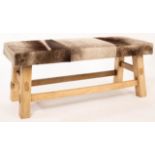 A hide upholstered stool,