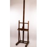 An artist's oak easel, with adjustable rest,