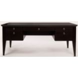 An Italian ebonised oak kneehole desk, fitted a surround of five drawers,