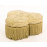 A George Smith cloverleaf pouffe upholstered in pale green floral damask with long tassel fringing,