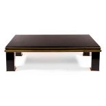 A Maison Jansen black and gold coffee table,