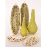 Poole Pottery, two freeform cucumber dishes, 32cm long, two plain bottle vases,