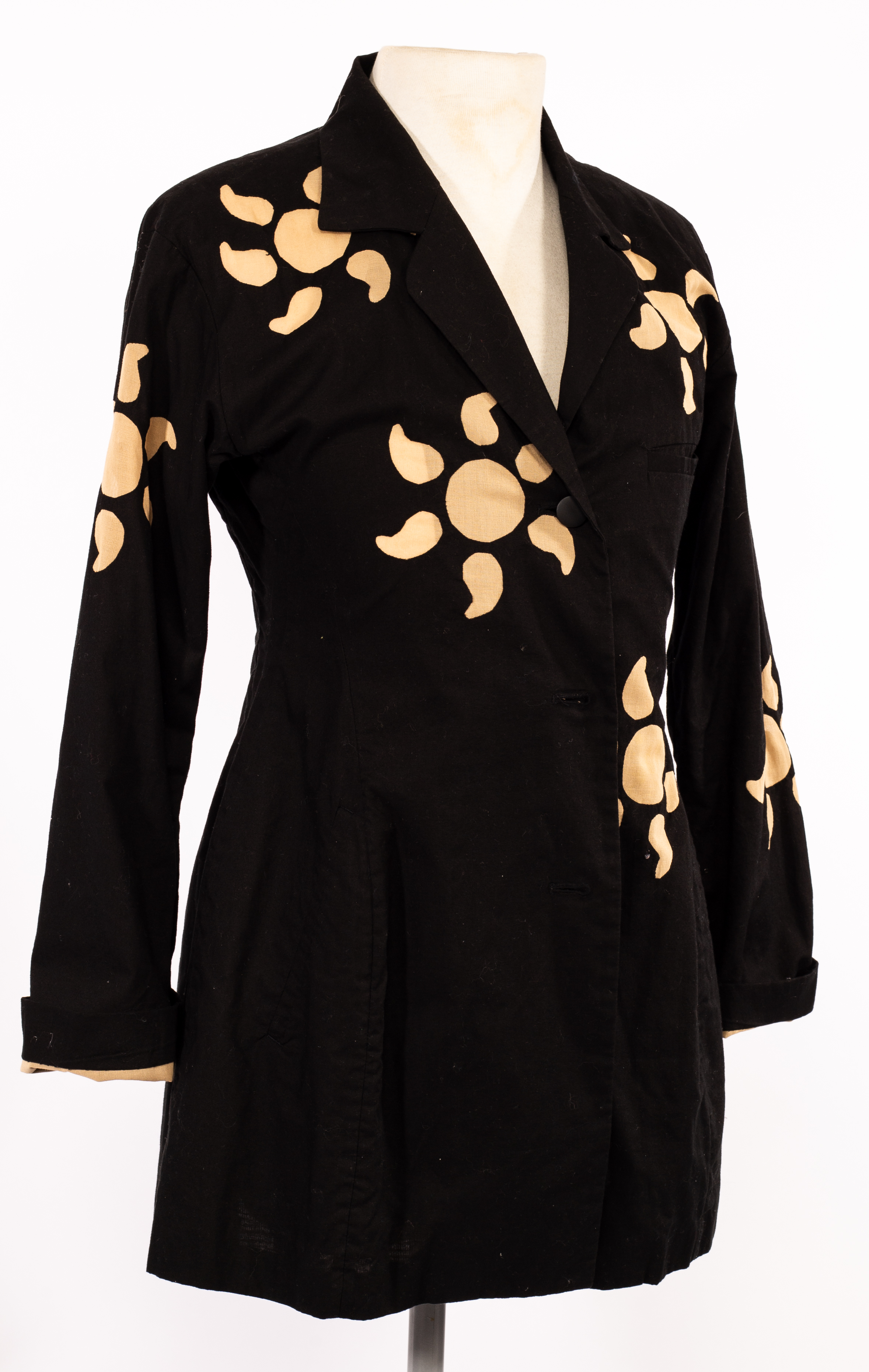 Issey Miyake, a black cotton 'sunshine' jacket with decorative cut-out designs,