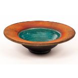 Simon Rich (born 1949), a raku fired footed bowl, orange/pink rim with turquoise glazed centre,