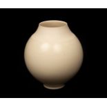 Anna Silverton (Contemporary), a circular porcelain vase, cream glaze, incised signature, 14.