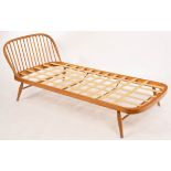 Lucien Ercolini for Ercol, an elm and beech single bed, with curved spindled headboard,