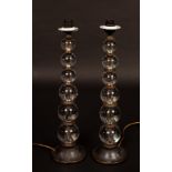 A pair of table lights, the column of each six graduating glass balls,